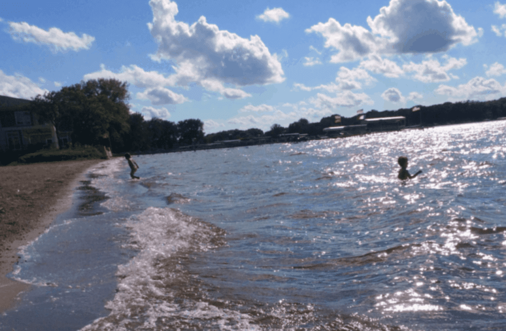 Kids playing in Clear Lake at dusk