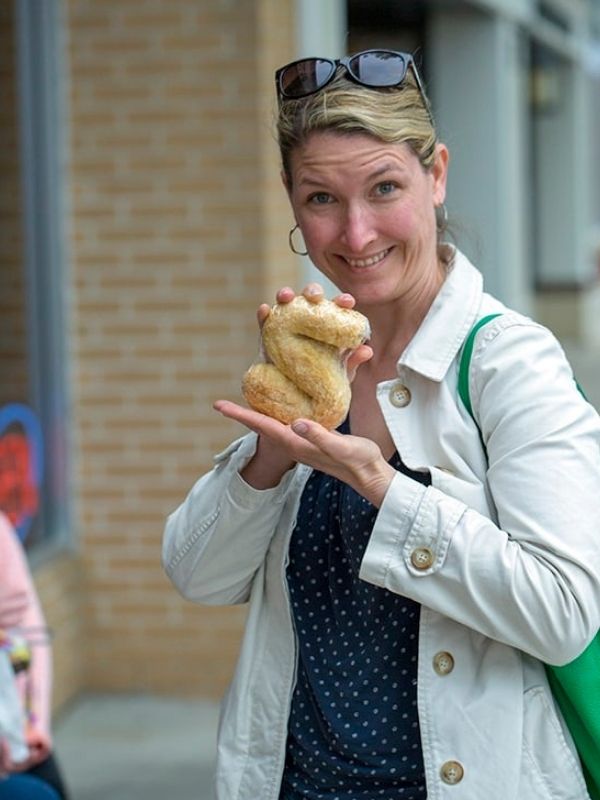 Kim holding a Dutch letter pastry in Orange City