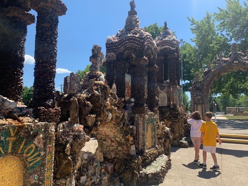 Kids walking around The Shrine of the Grotto of Redemption in West Bend, Iowa