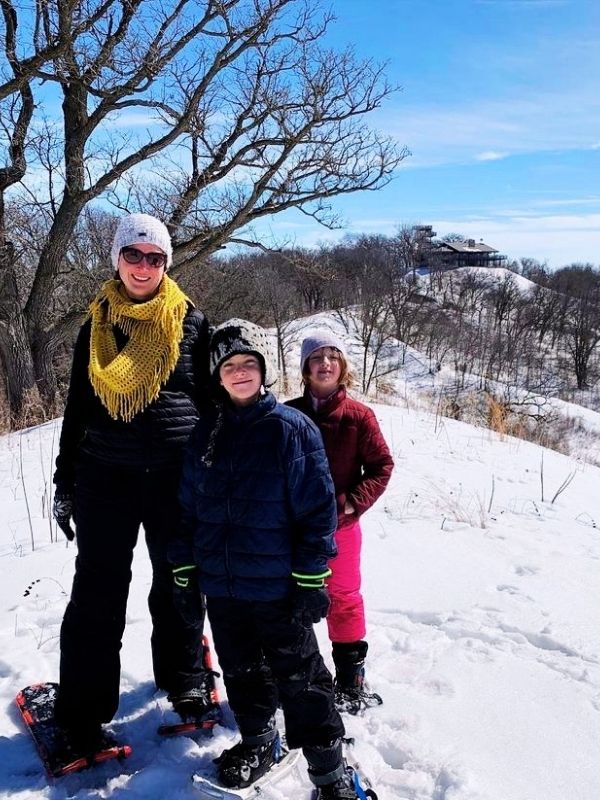 Kim and kids wearing snowshoes at Hitchcock Nature Center