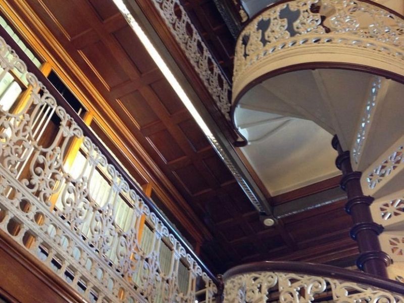 Up-close photo of the spiral staircase inside the law library of the Iowa Capitol building