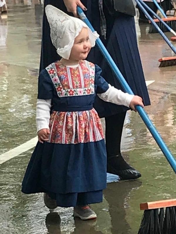 A little girl helps with the street scrubbing during the Tulip Festival in Orange City