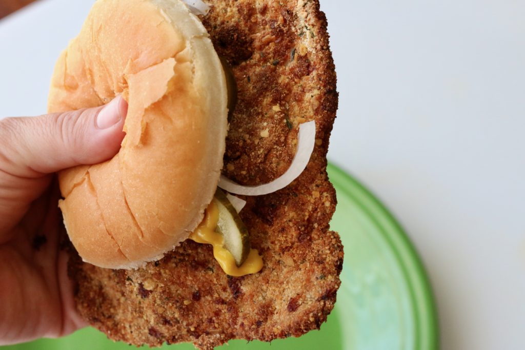Close-up photo of an air fryer pork tenderloin sandwich