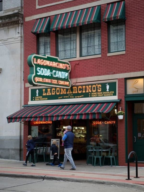 People walking by Lagomarcino's, an iconic candy and ice cream shop in Quad Cities