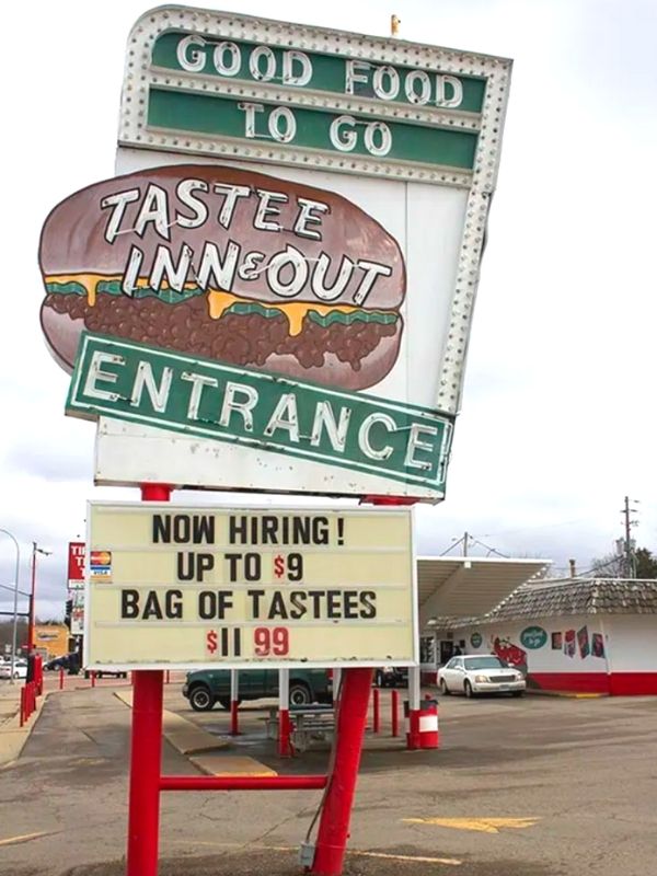 A neon sign for Tastee Inn & Out in Sioux City