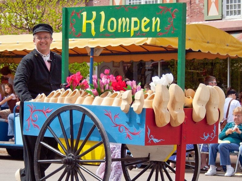 A man pushes a wooden shoe cart in Pella, Iowa