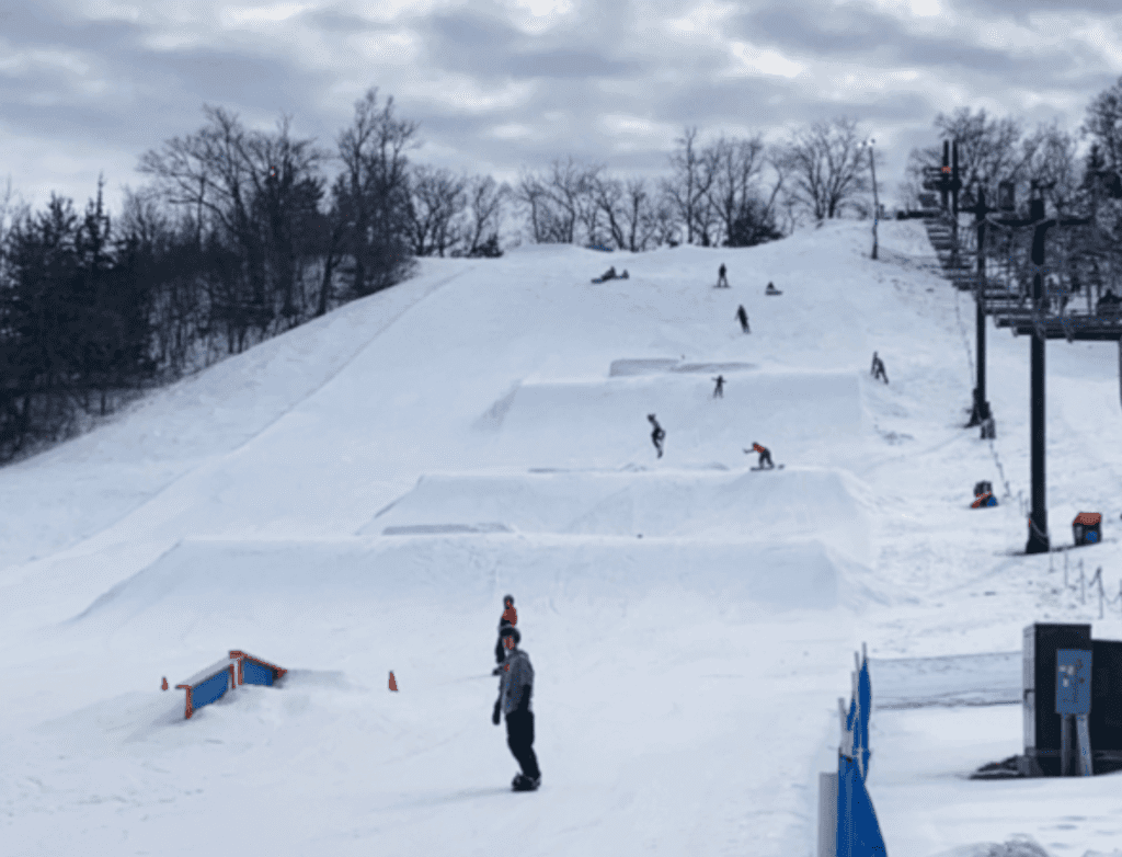 People snowboarding in Boone, Iowa