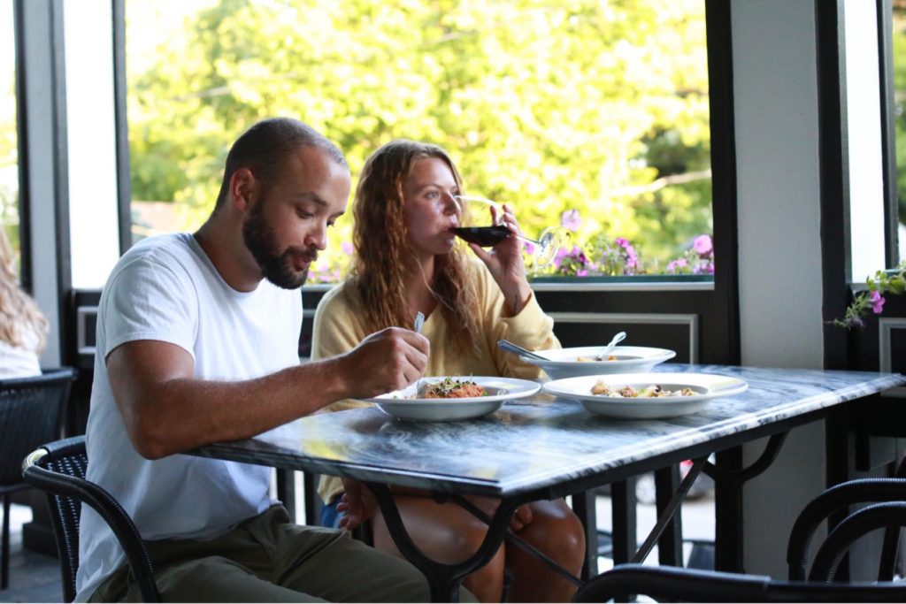 The restaurant Aposto is housed inside an 1880 Victorian mansion, and has outdoor seating on its porch.