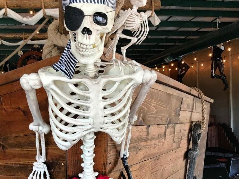 A skeleton on a pirate ship inside Pirate Putt, an indoor mini golf place in Council Bluffs