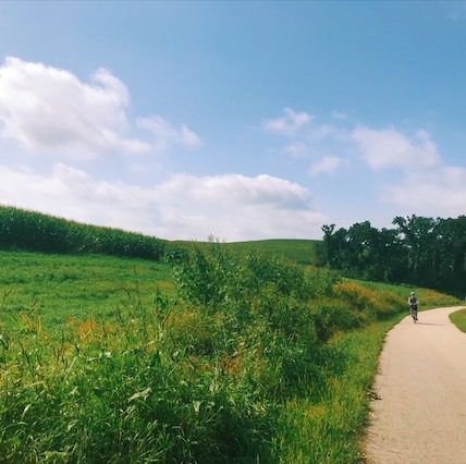 A lone biker on the Trout Run Trail in Decorah, Iowa 