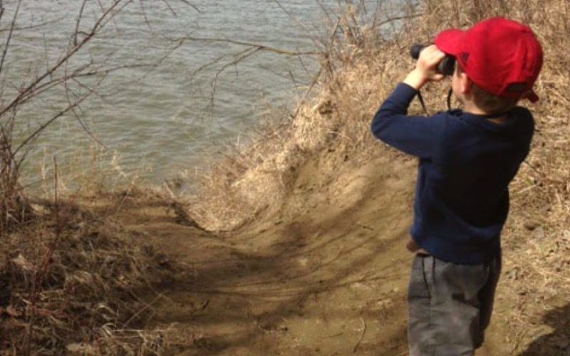Boy with binoculars at DeSoto National Wildlife Refuge