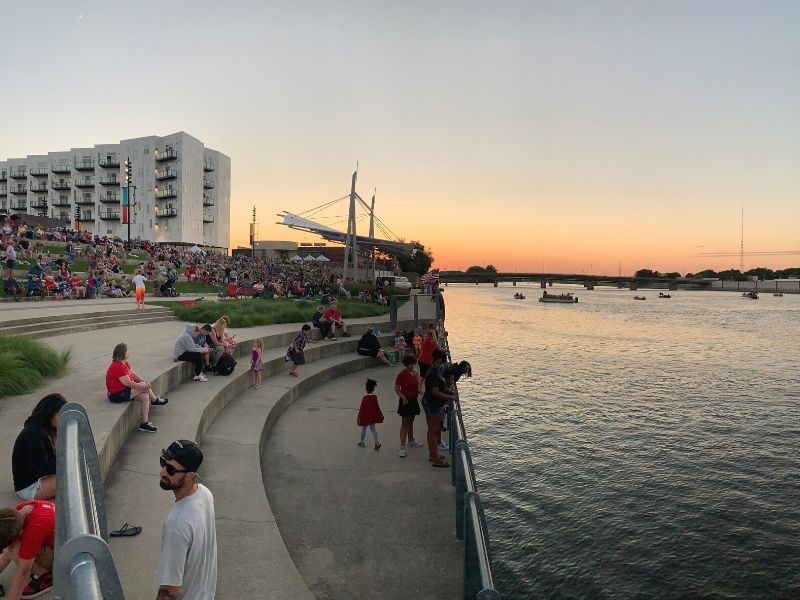 A crowd gathers by the RiverLoop Amphitheater for Fourth of July weekend festivities
