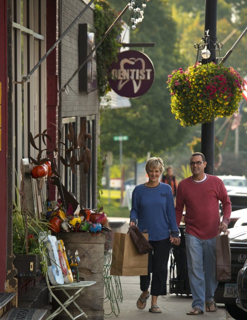 Shoppers walk around Mount Vernon