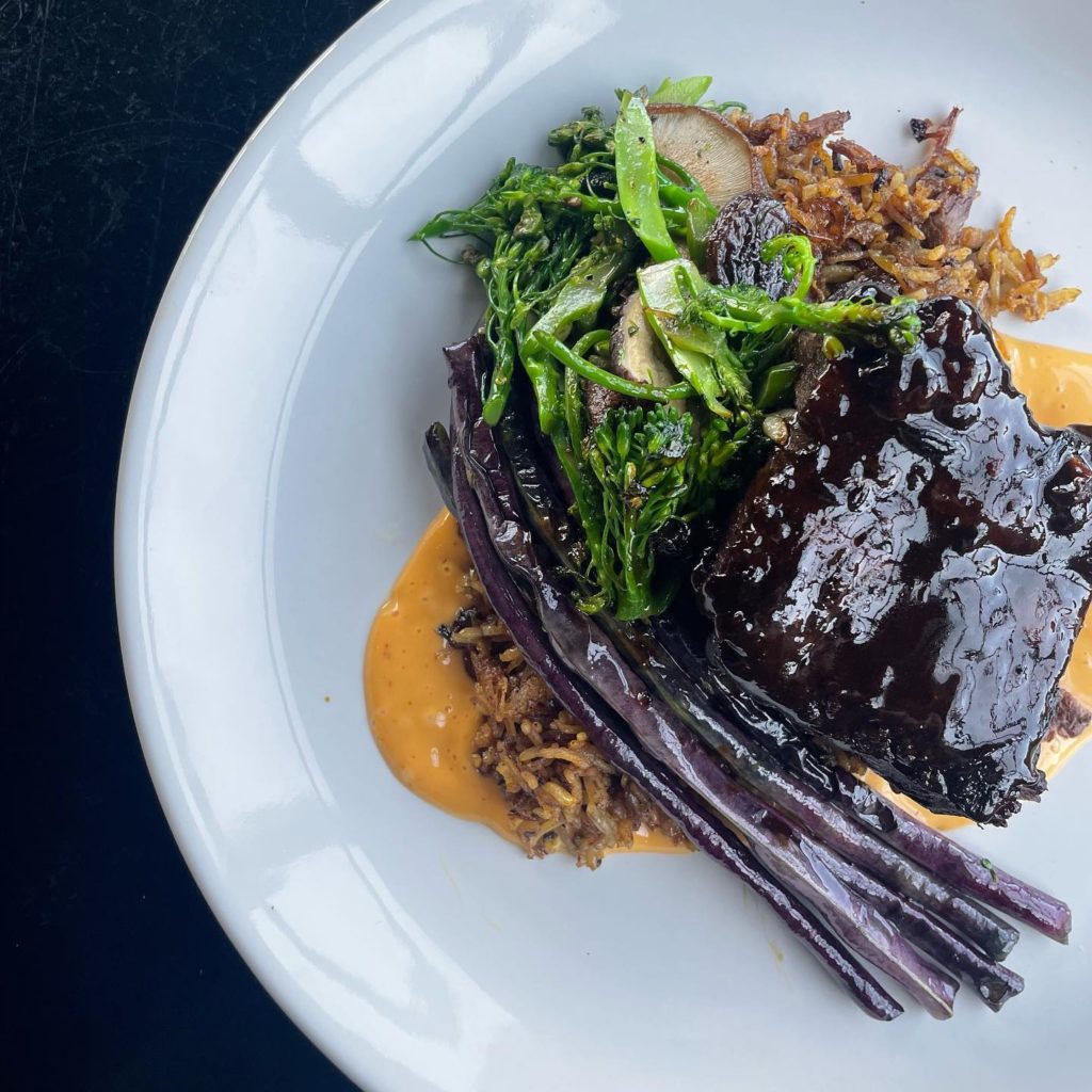 A plate of short ribs at Provisions Lot F in Ames, Iowa