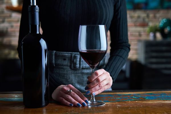 A woman with a glass of red wine