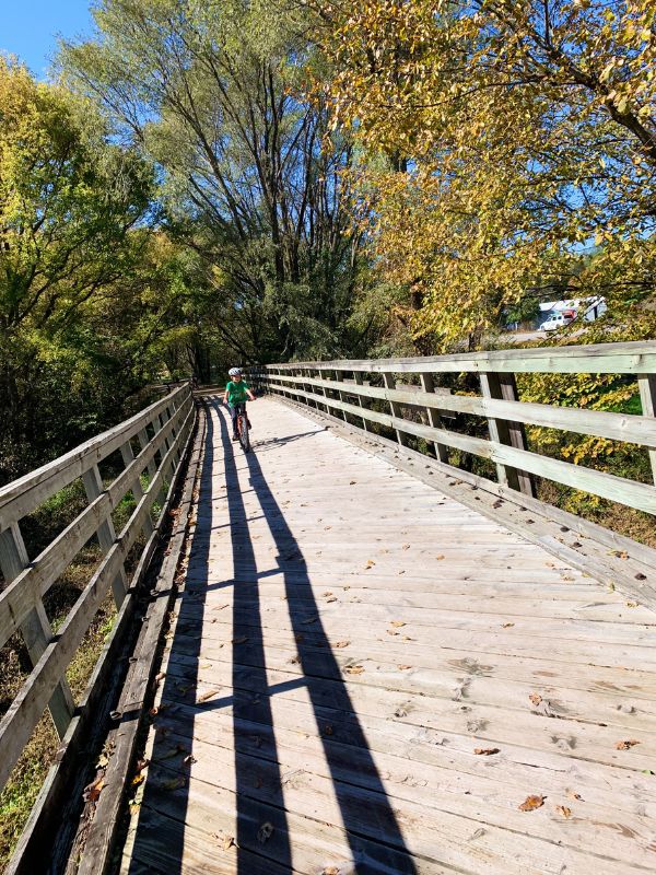 A young bicyclist on Wabash Trace Nature Trail in late summer