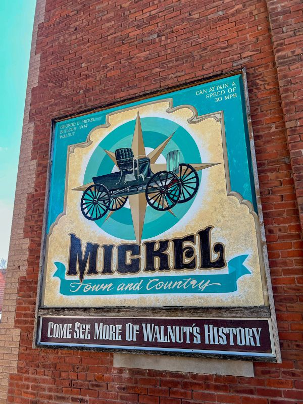 An advertisement on a brick wall in Walnut, Iowa