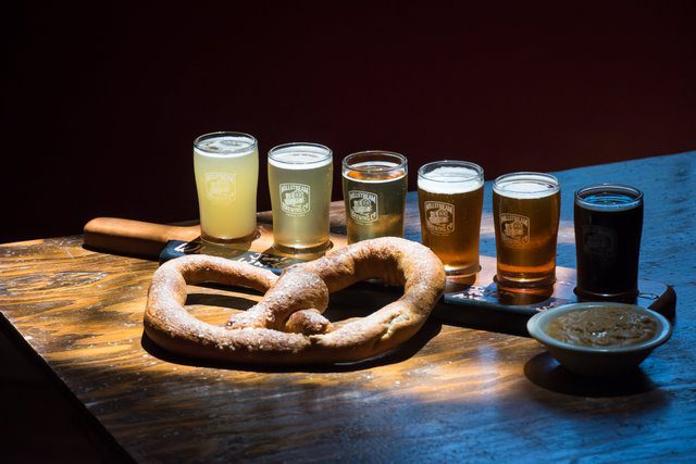Flight of beer and a pretzel at Millstream Brewery in Amana