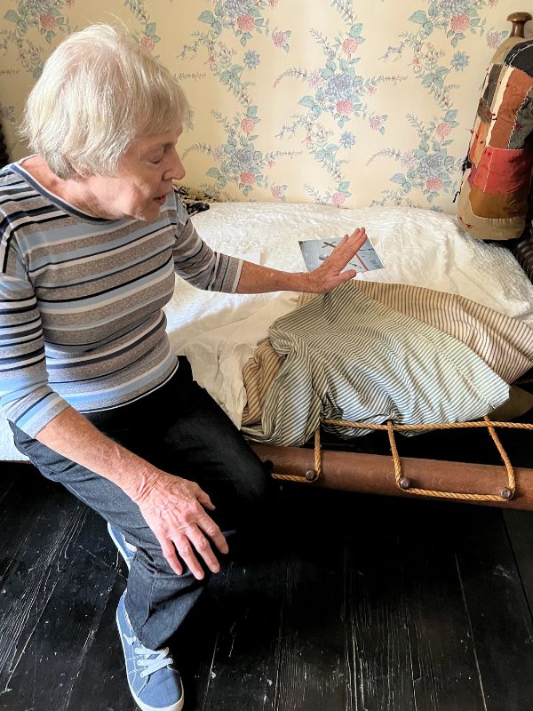 The tour guide and an 1845 rope bed