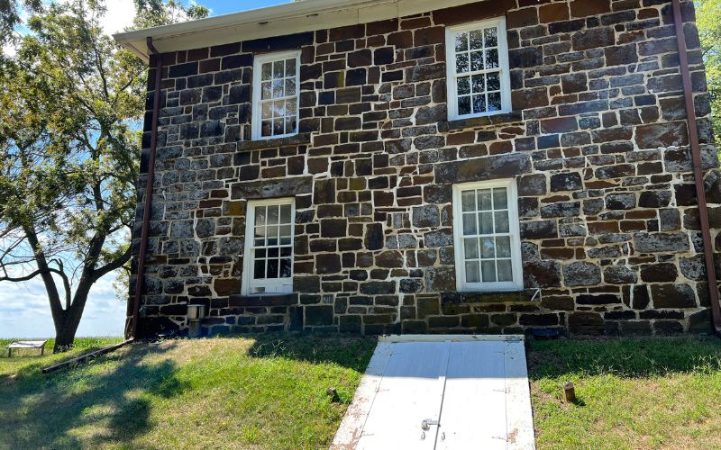 The exterior door that leads to the basement of the Hitchcock House