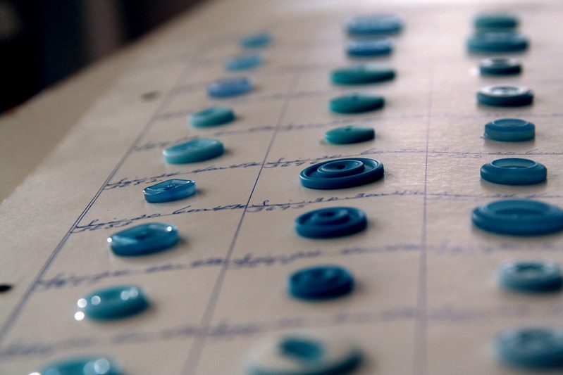 Close up photo of blue pearl buttons