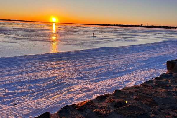 Sunset over the frozen Clear Lake 