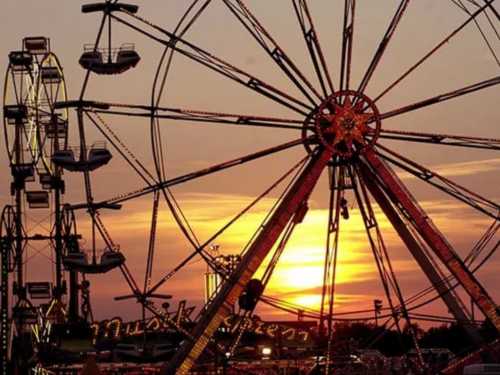 The Iowa State Fair midway at dusk in Des Moines