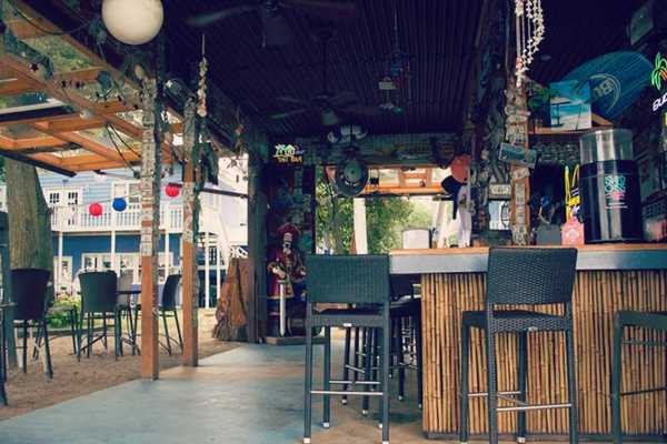 The festive tiki bar at PM Park along the south shore of Clear Lake