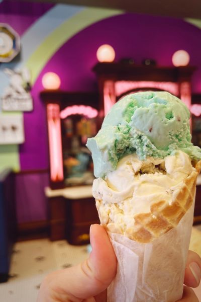 An up-close photo of a waffle cone with two scoops of Blue Bunny ice cream