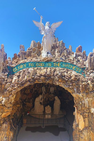 "Glory to God in the highest" written on the wall at the Grotto of Redemption