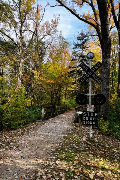 A trail head and railroad crossing sign at Jefferson County Park