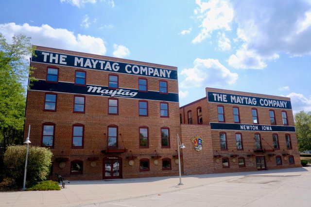 The red brick factory buildings of Maytag Company will be renovated to become the new Wringer Hotel in 2024