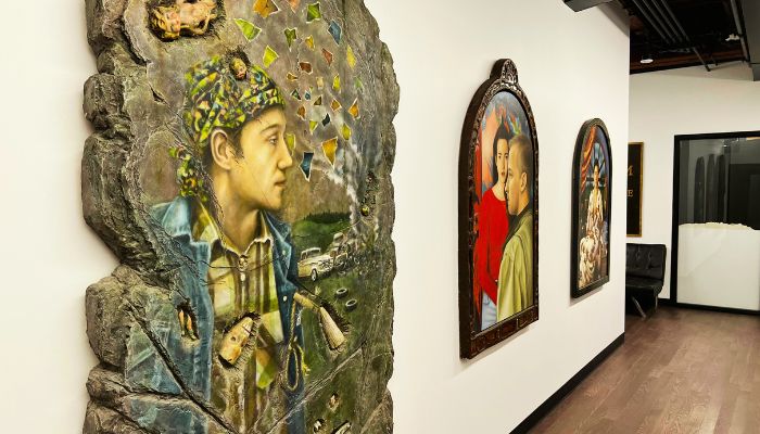 A hallway lined with artwork at Hoff Family Arts & Culture Center in downtown Council Bluffs