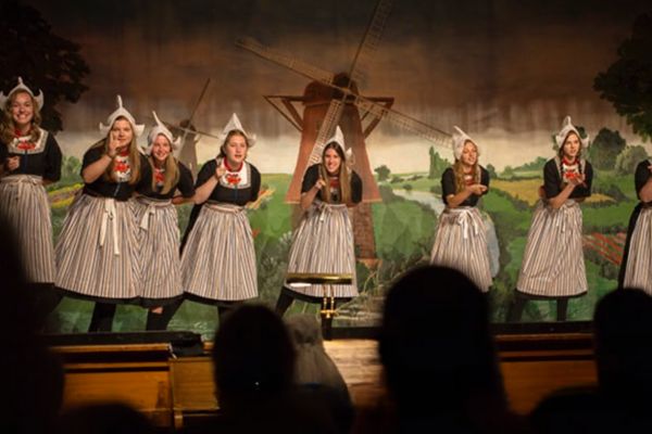 A performance of The Dutch Dozen, a troupe of female performers who sing and dance during the Orange City Tulip Festival